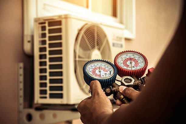 Professional Air Conditioning Service technician working in Milan, OH